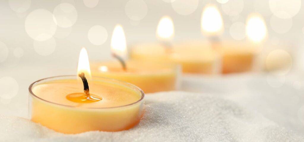 Row of candles in the sand