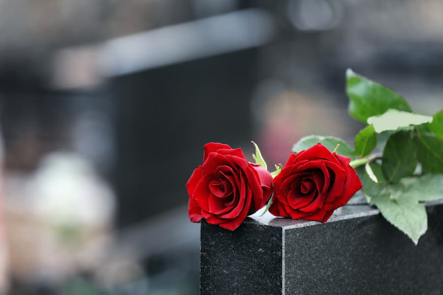 Black Granite Headstone With Red Roses
